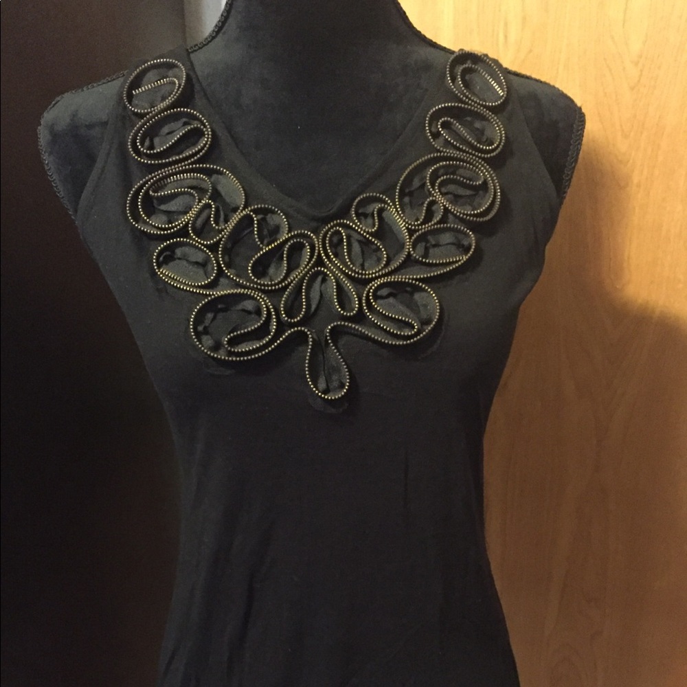 Women’s sleeveless black blouse with ruffle front